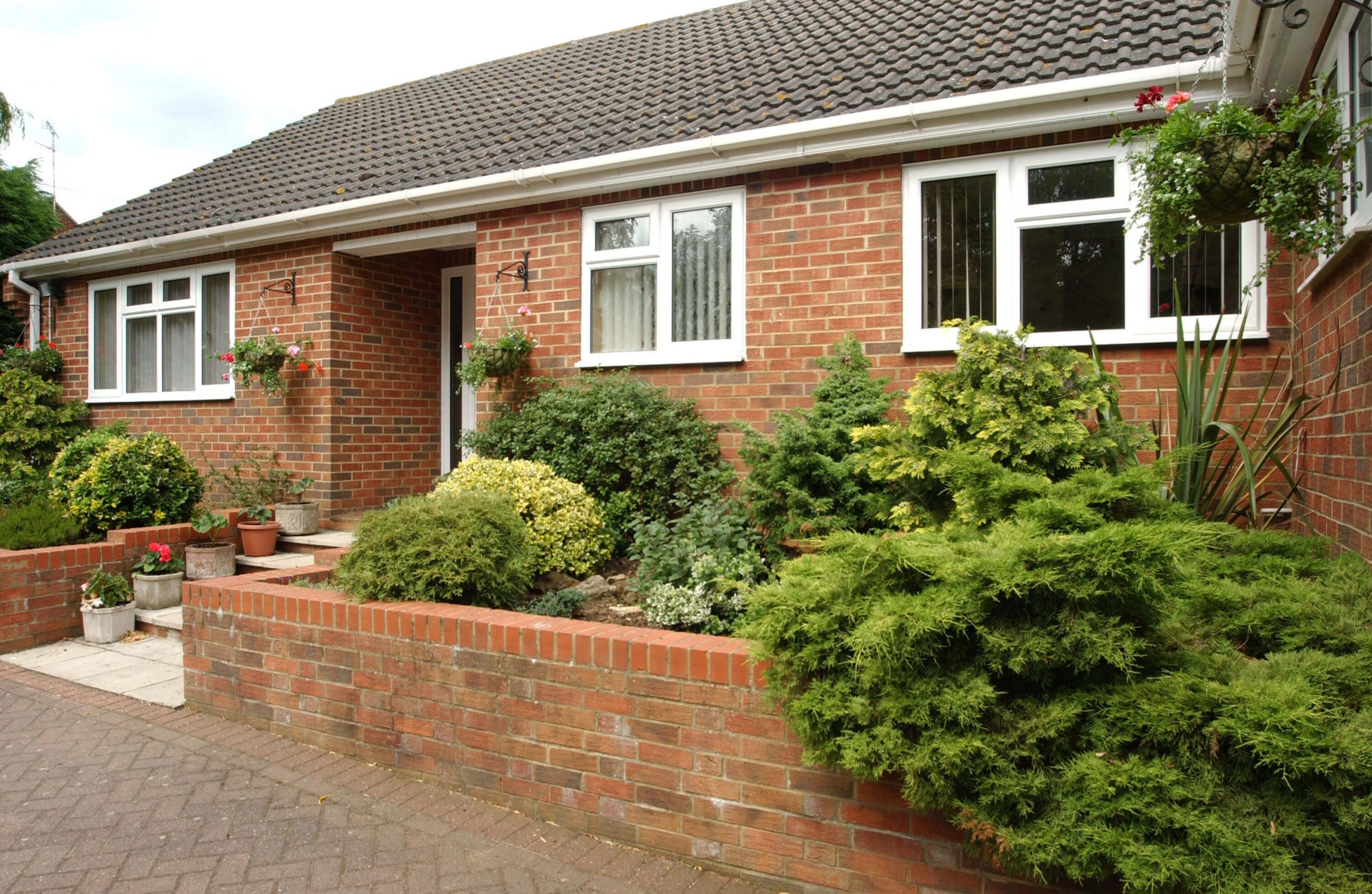 Red brick bungalow with white upvc windows