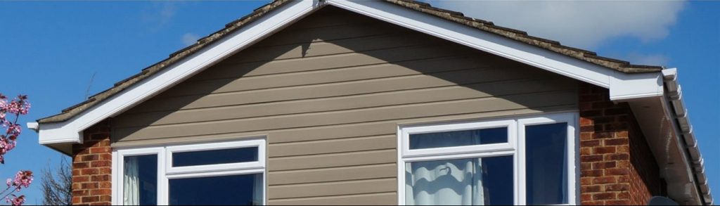 House with Cladding and Casement Windows